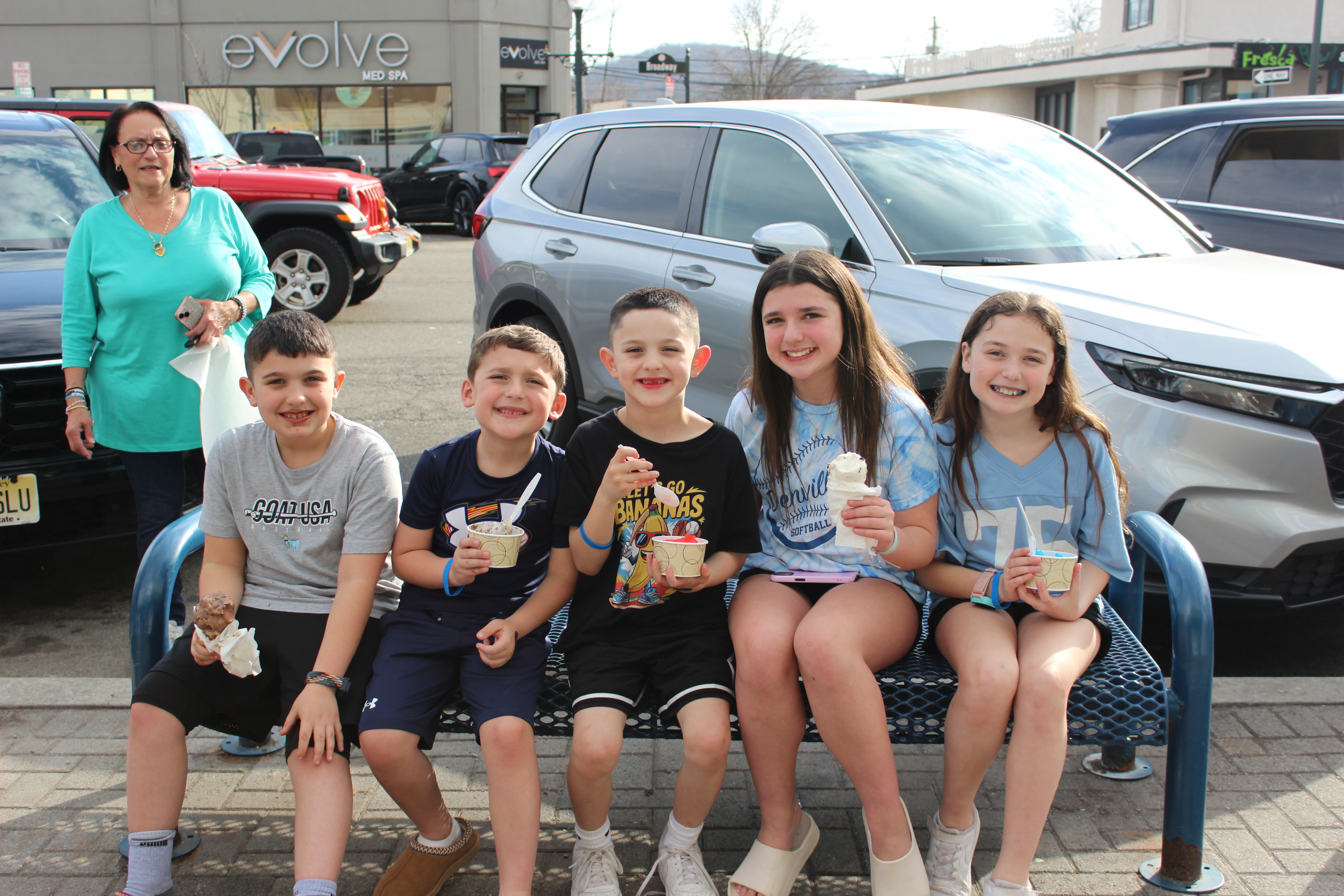 Children meeting a Denville police officer at Cone With a Cop at Denville Dairy